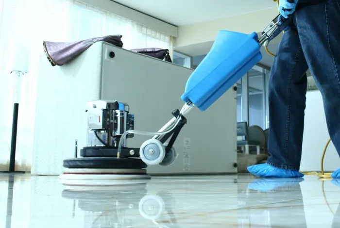 Professional floor machine restoring shine to a marble office floor